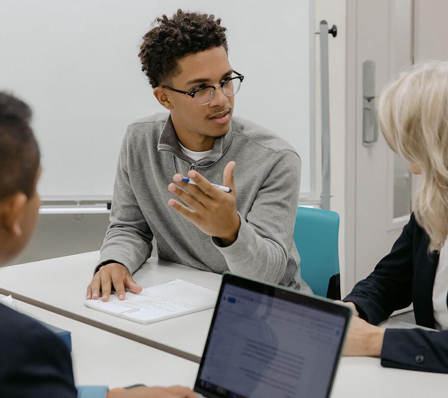 Students from the business data analytics program engage in a classroom discussion.